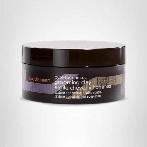 Aveda Men Pure-Formance Grooming Clay tube close-up with natural ingredients label.