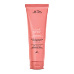 Aveda Nutriplenish Conditioner Light Moisture bottle close-up signaling hydration benefits for dry hair.