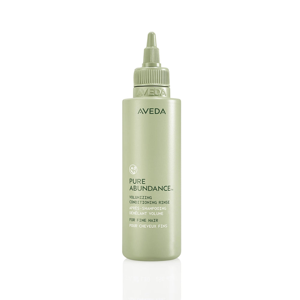 Aveda Pure Abundance conditioner bottle showing volume-boosting formula for fine hair.