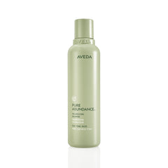 Aveda Pure Abundance shampoo bottle with clear branding.