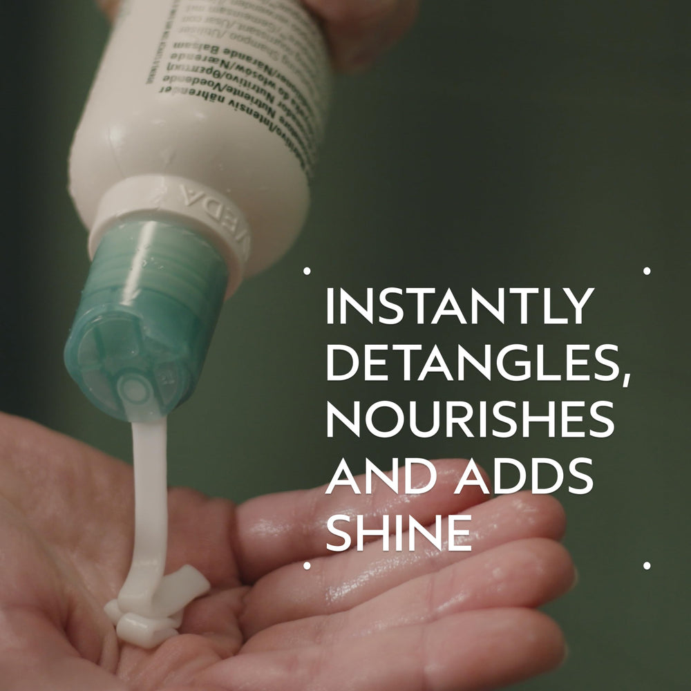 Applying Shampure Nurturing Conditioner to hair for detangling
