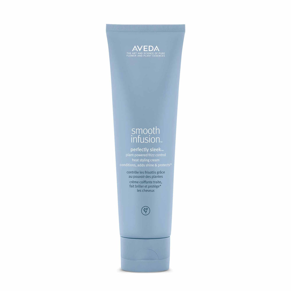 Aveda Smooth Infusion Perfectly Sleek bottle demonstrating frizz defense for textured hair.