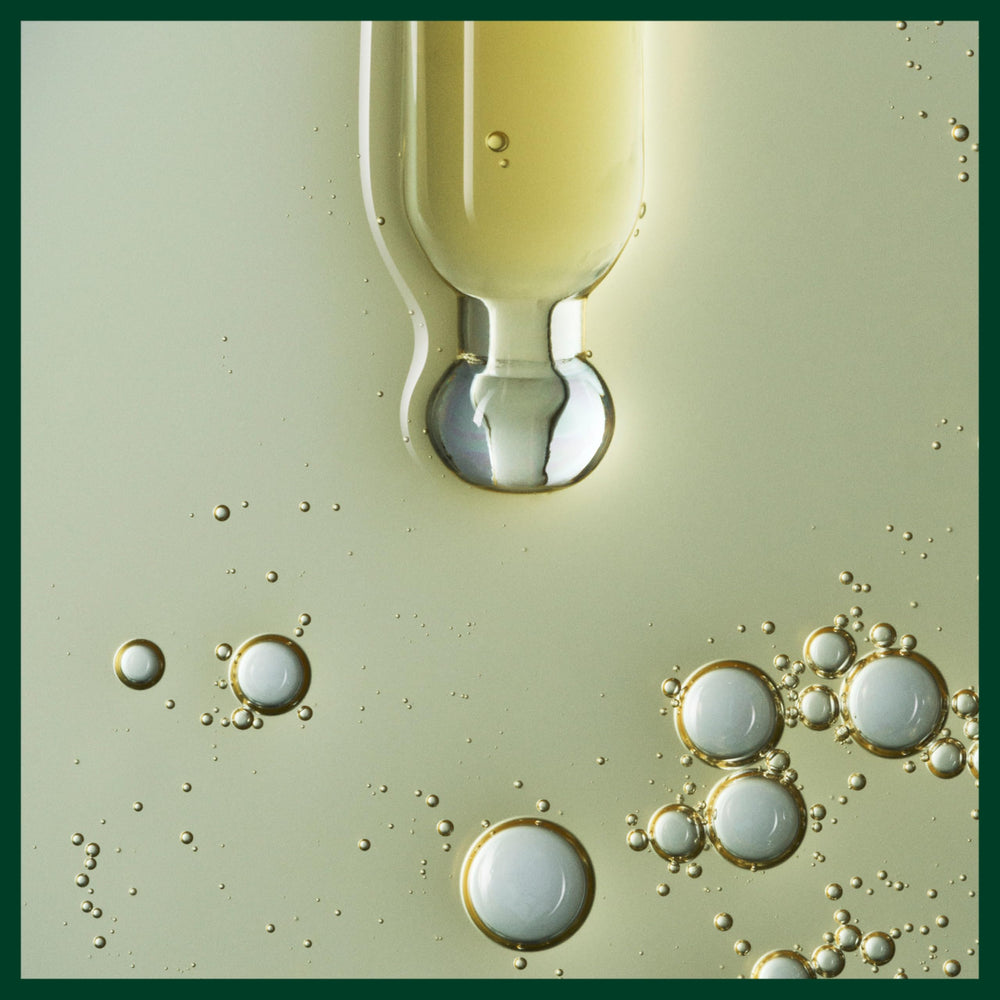 Aveda vegan-certified badge shown beside the serum bottle.