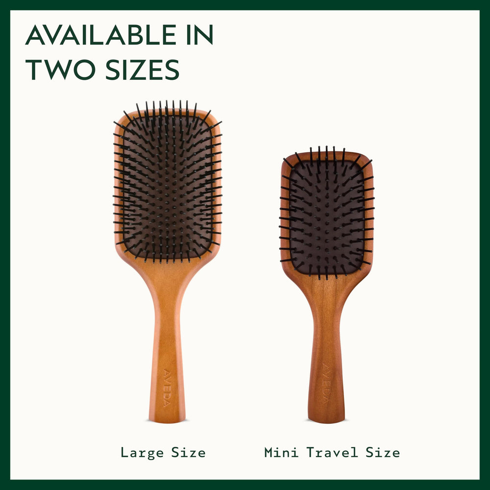 Aveda Wooden Mini Paddle Brush travel-sized for on-the-go styling.