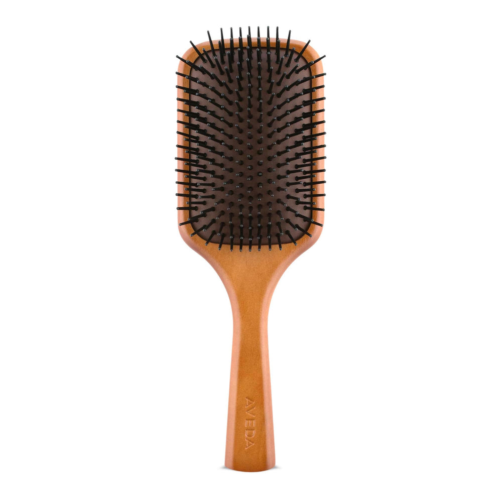 Aveda Wooden Paddle Brush detangles hair with extended bristles.