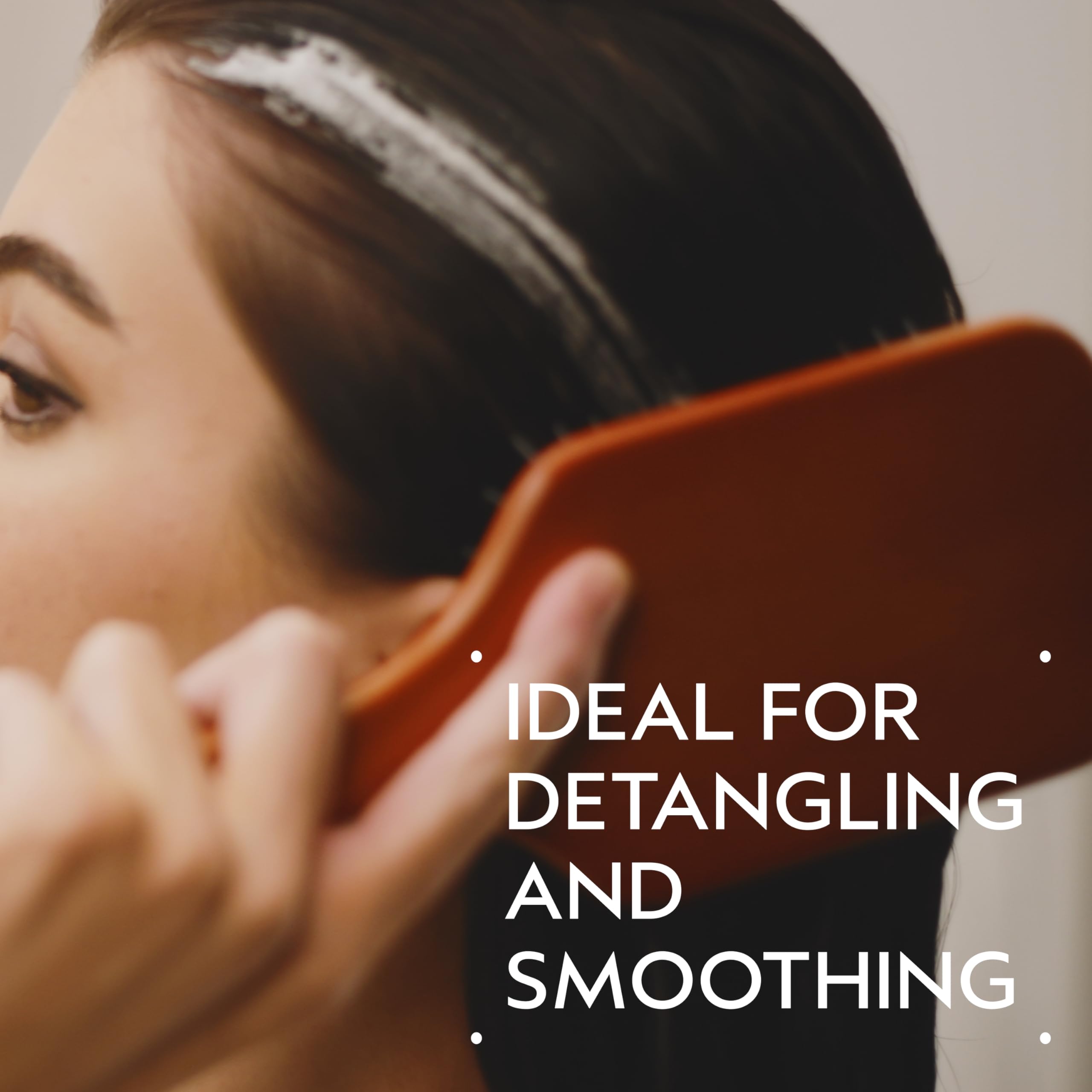 Aveda Wooden Paddle Brush smooths hair during blow-drying for sleek results.