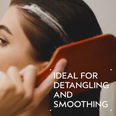 Aveda Wooden Paddle Brush smooths hair during blow-drying for sleek results.