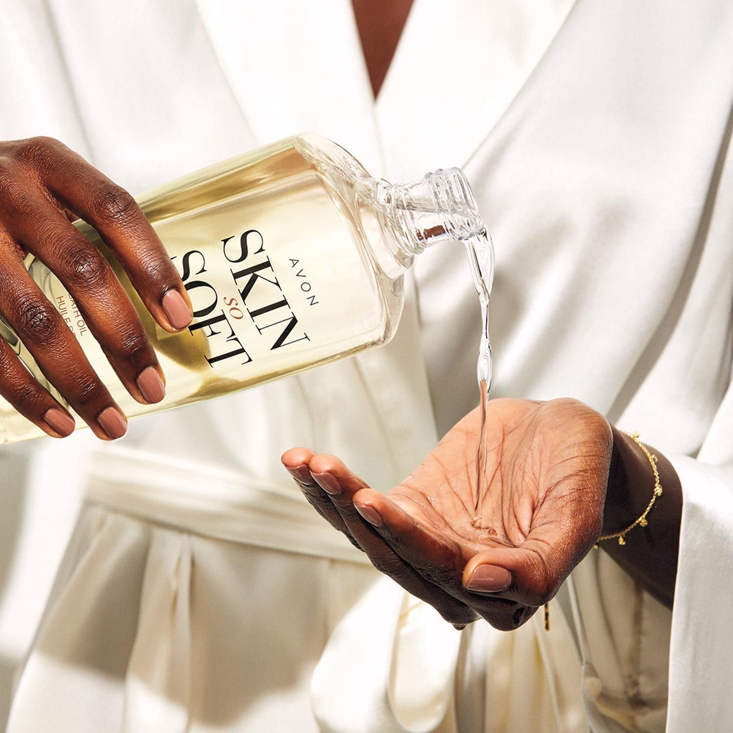 AVON Skin So Soft Radiant Moisture 25 oz bottle highlighting rich hydration.