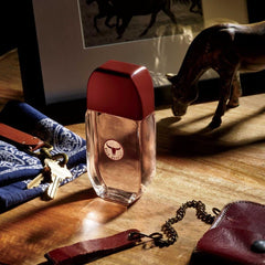 AVON Wild Country bottle with wood backdrop evoking outdoor vibe