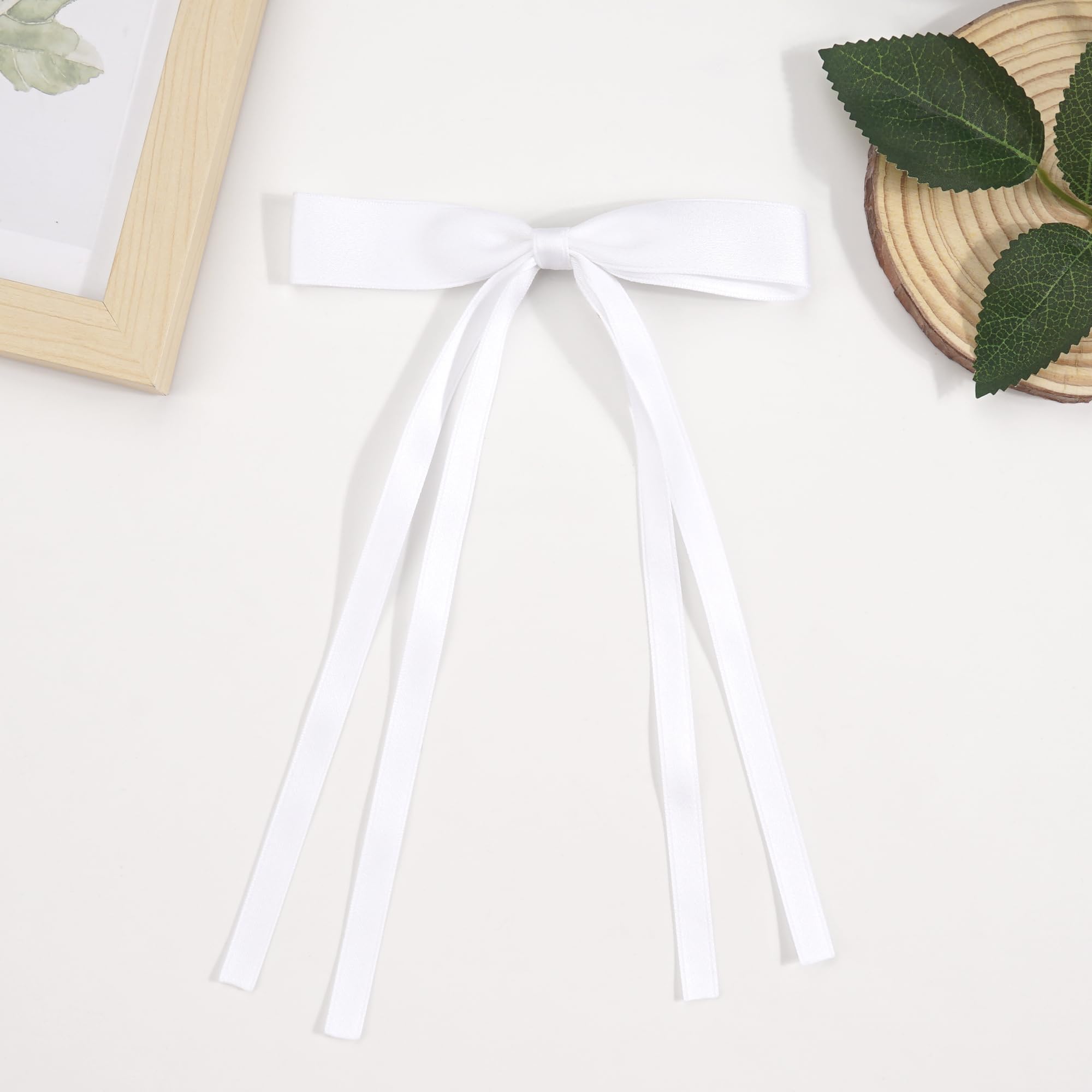 Ayesha bowknot clips with long tails stay in place through activities.