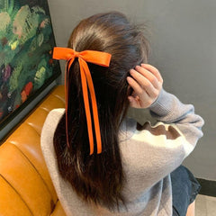 Ayesha tassel ribbon bowknot clip adds cute flair to updos.