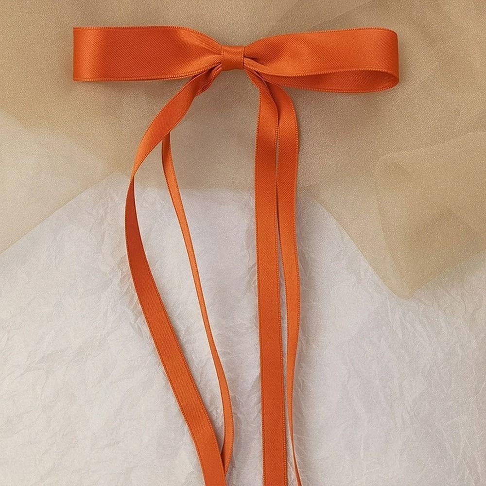 Ayesha orange wedding party hair accessory for photos and gift ideas.