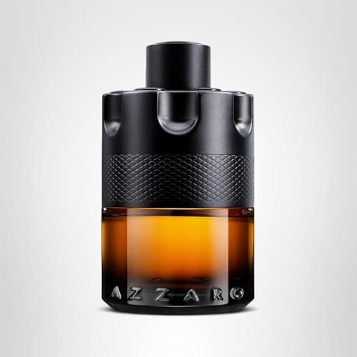 Azzaro The Most Wanted Parfum amber juice on wooden surface evokes warmth and ambiance
