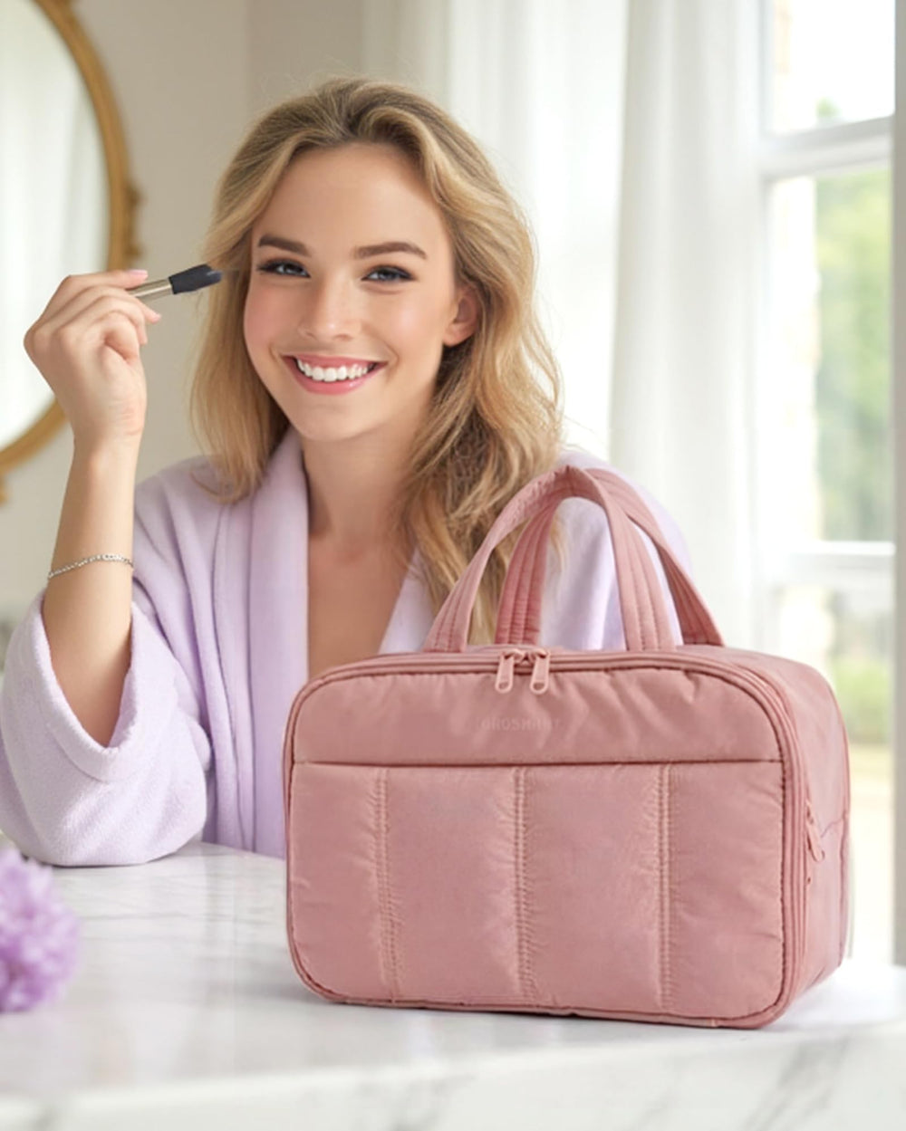 BAGSMART dark pink toiletry bag main compartments keep cosmetics organized during travel.