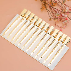 Bantoye gold clip holds hair sections for coloring with neat results.