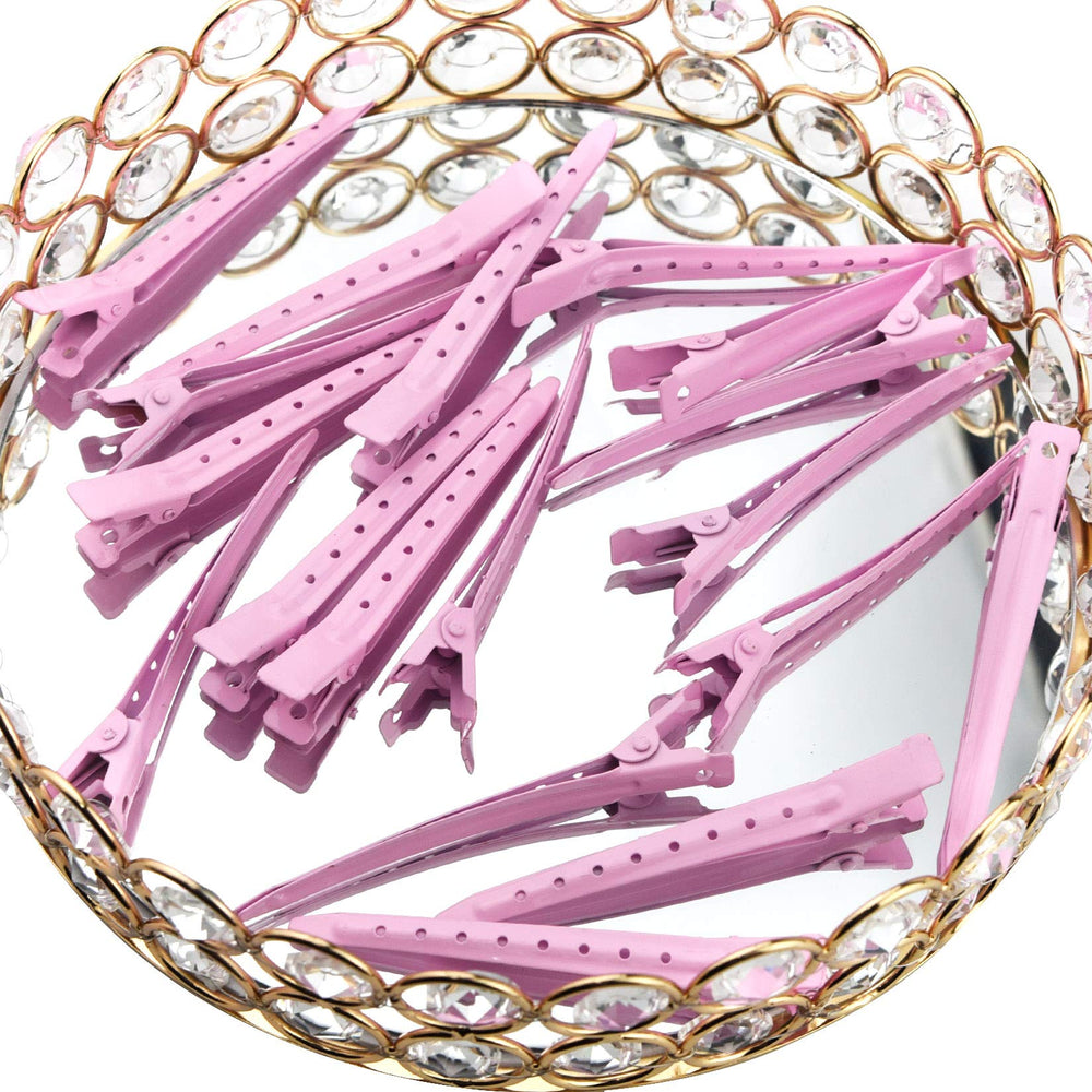 Bantoye pink clip securing hair during styling for curling or blow-drying.