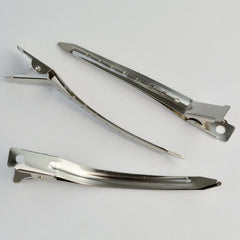 Bantoye clip holds hair during drying or setting in a professional routine.