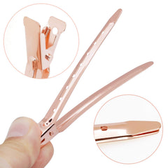 Bantoye metal alligator clip with holes directs hair while coloring.