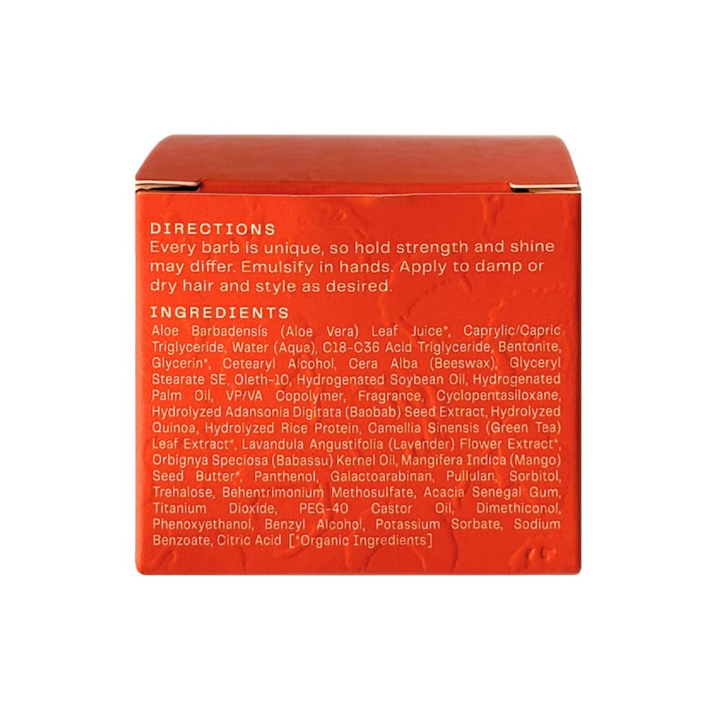 Close-up packaging of Barb Soft Clay Pomade showing travel-friendly 2 oz size