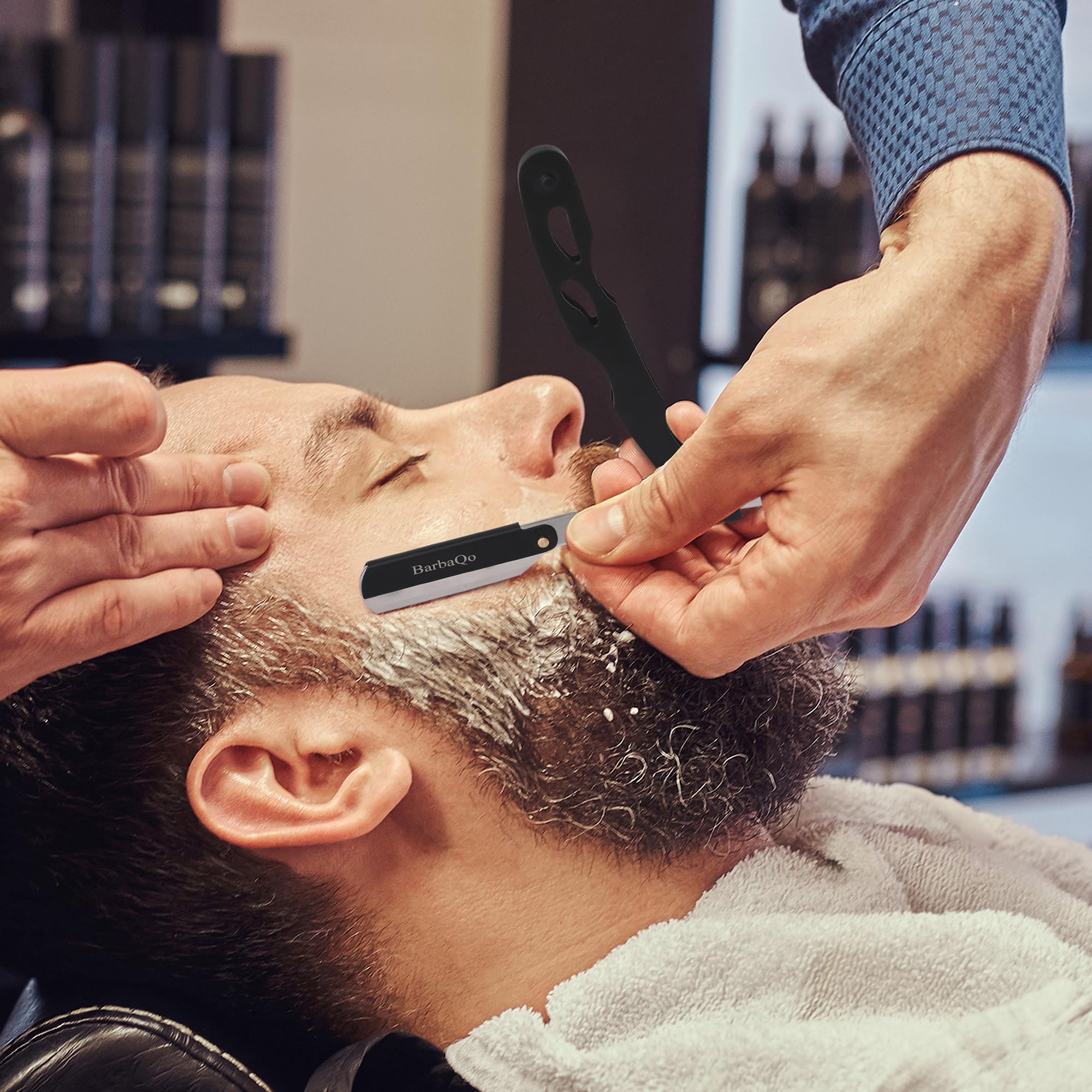 BarbaQo Straight Razor in a barber shop setting ideal for professionals.