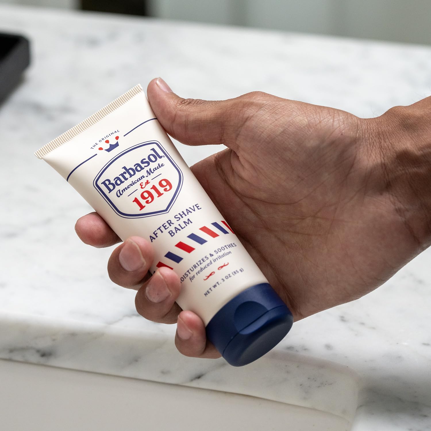 Barbasol 1919 balm being gently rubbed into fresh shave skin