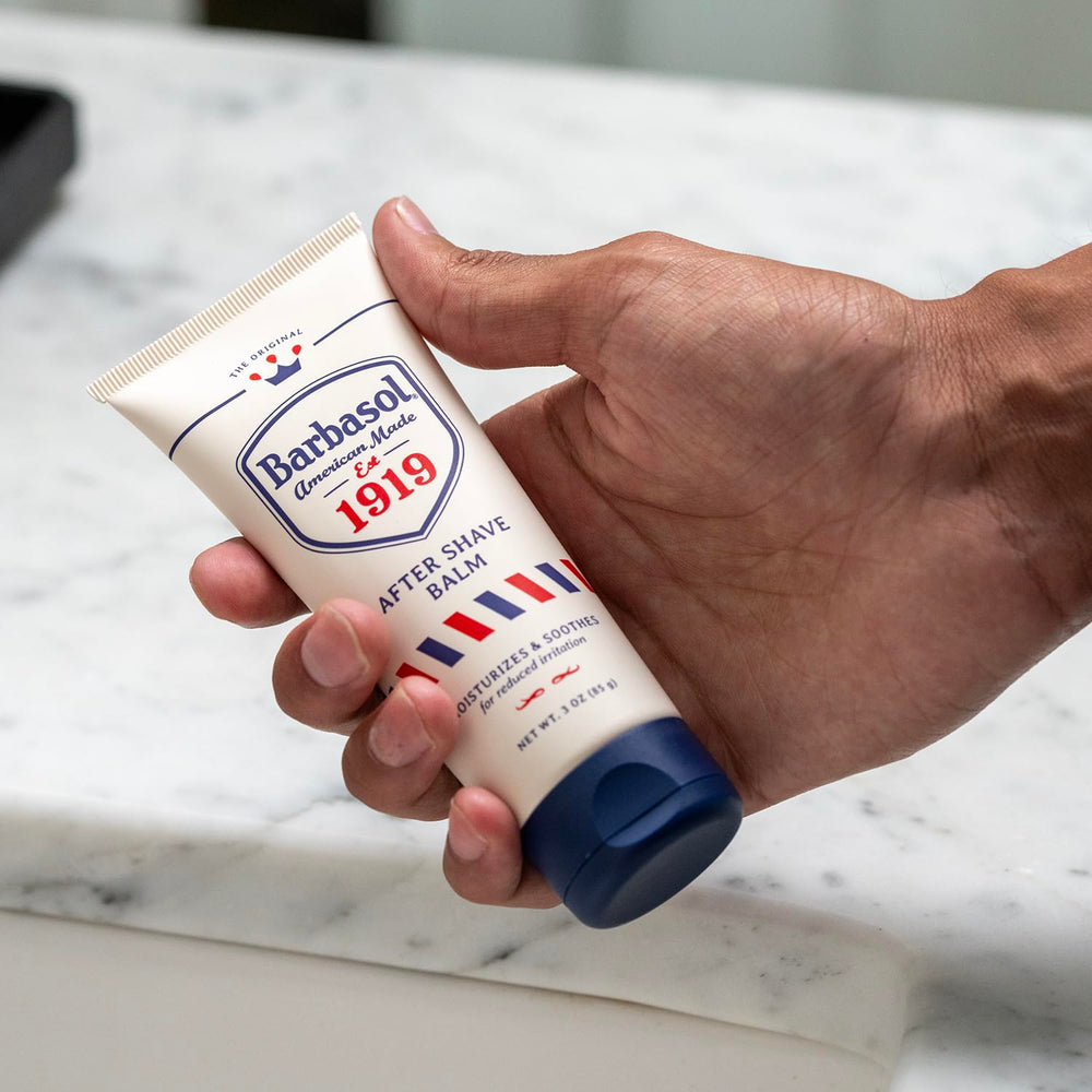 Barbasol 1919 balm being gently rubbed into fresh shave skin