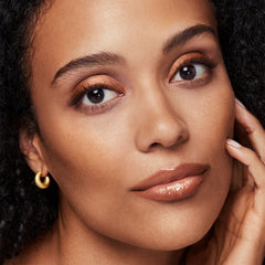 application of bareMinerals All-Over Face Color Bronzer Warmth on cheekbones
