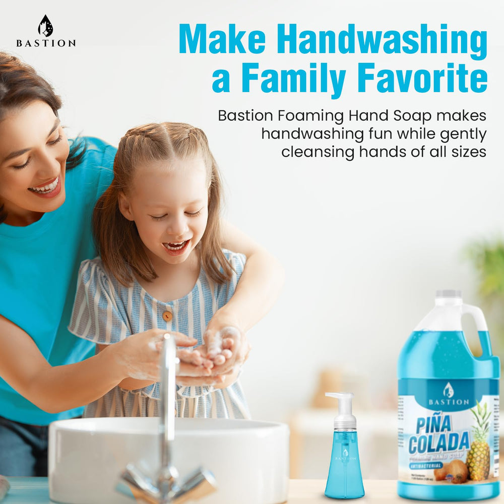 Bastion Pina Colada hand soap near dispenser illustrating gentle cleansing.