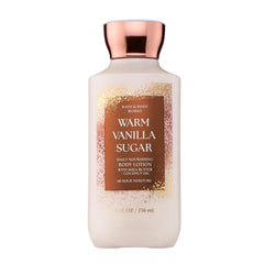Bath & Body Works loción corporal vainilla cálida, volcado de botella, hidratación suave diaria.