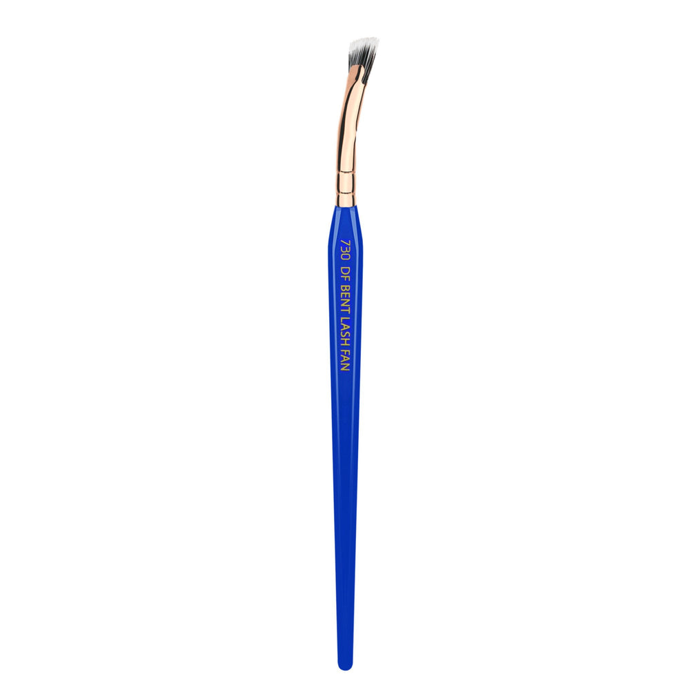 Bdellium Tools Golden Triangle 730 mascara fan reaching lash roots with precision.
