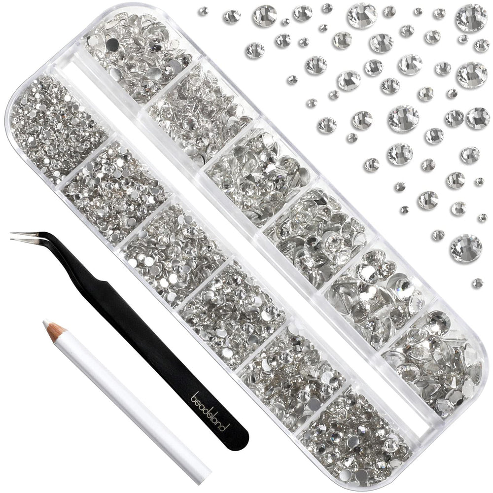 Beadsland tweezers and picking pen aiding precise rhinestone placement on nails