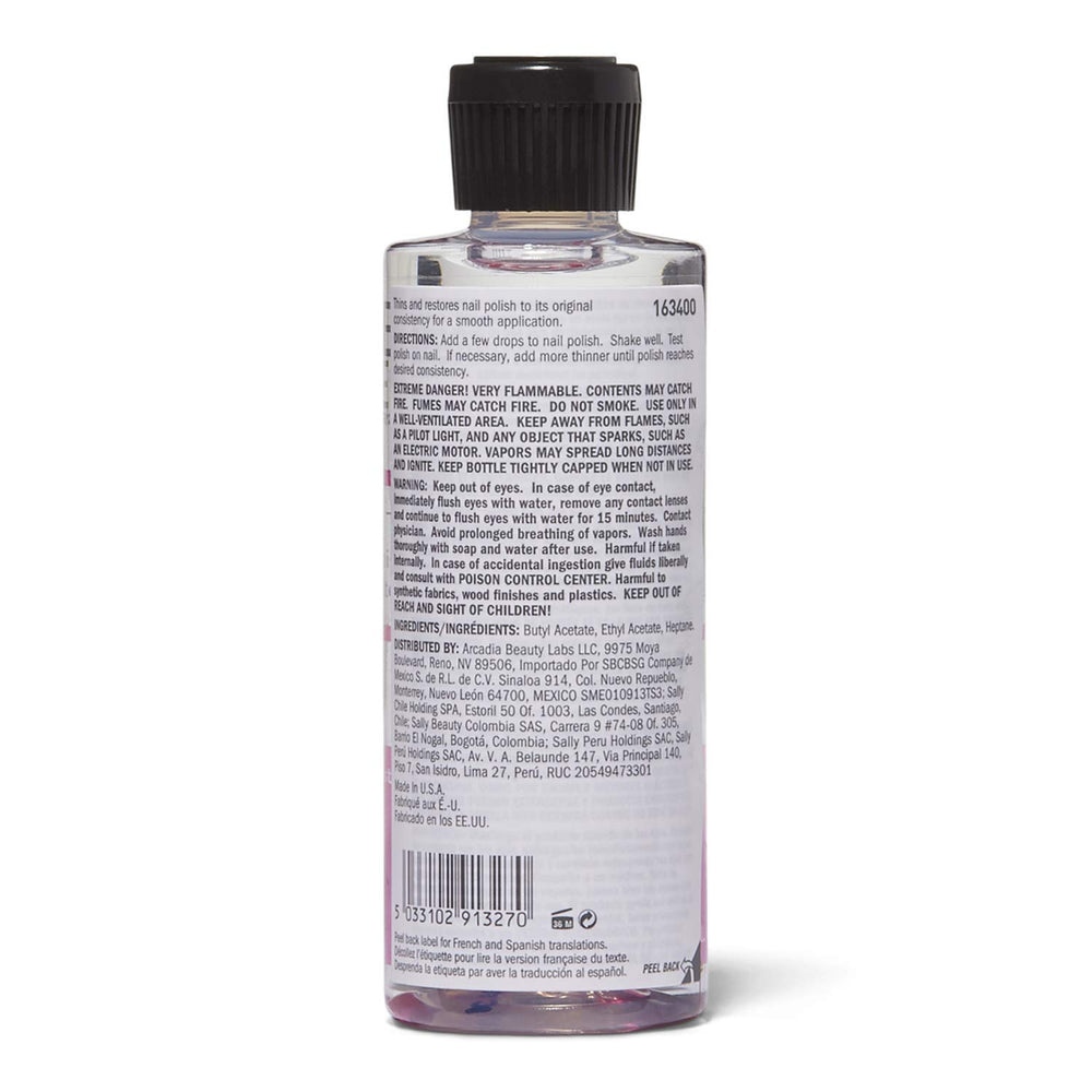 Beauty Secrets nail polish thinner pour demonstrates controlled thinning for precise manicure results.