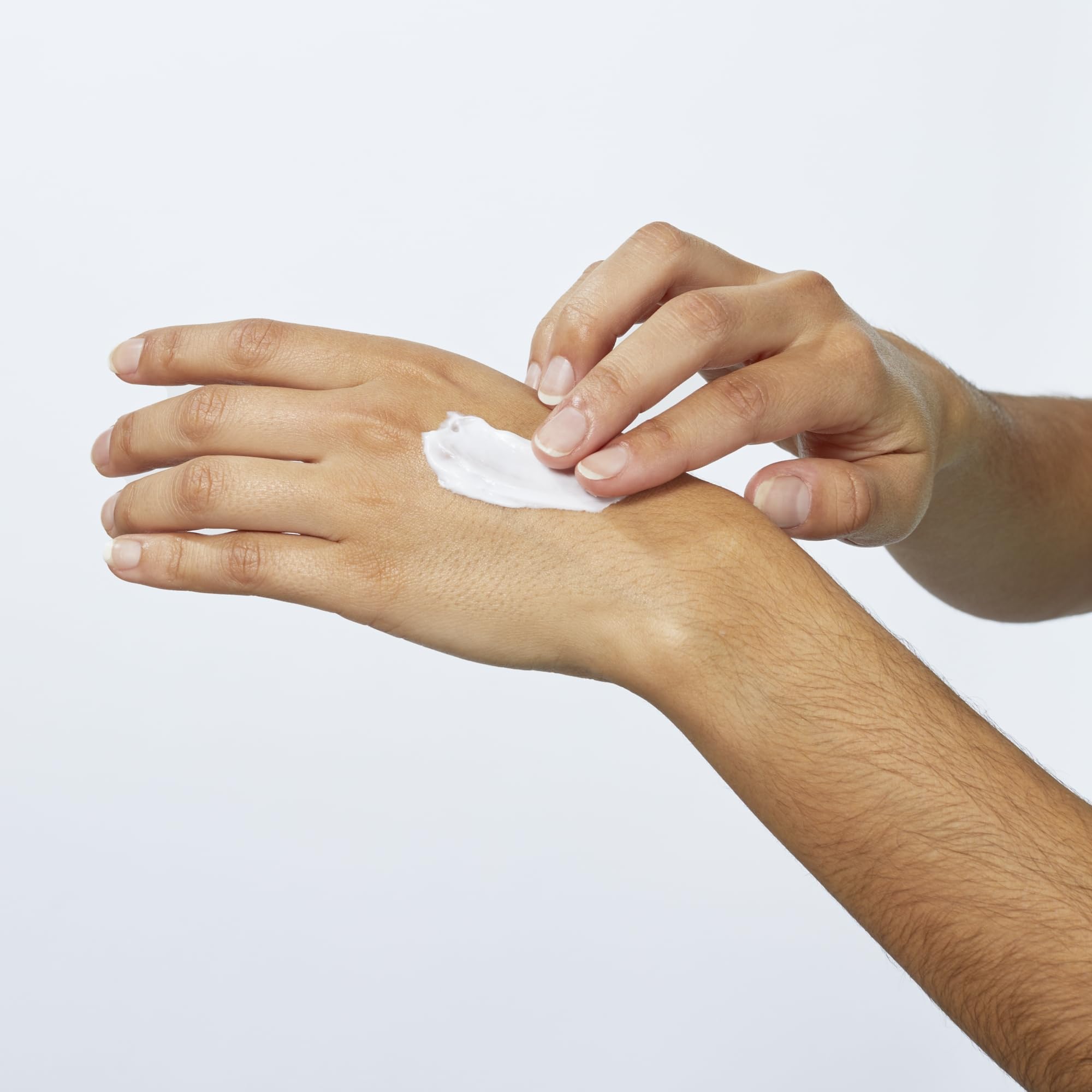 Hand applying Beekman 1802 lotion for non-greasy moisture