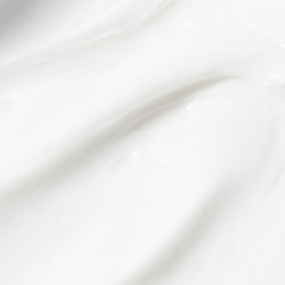 Close-up of Beekman 1802 lotion texture showing quick absorption