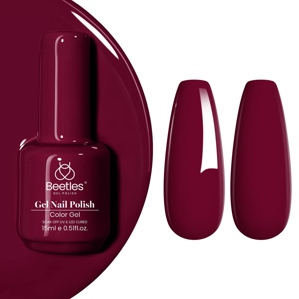 Beetles Burgundy Red nails look glossy under soft lighting