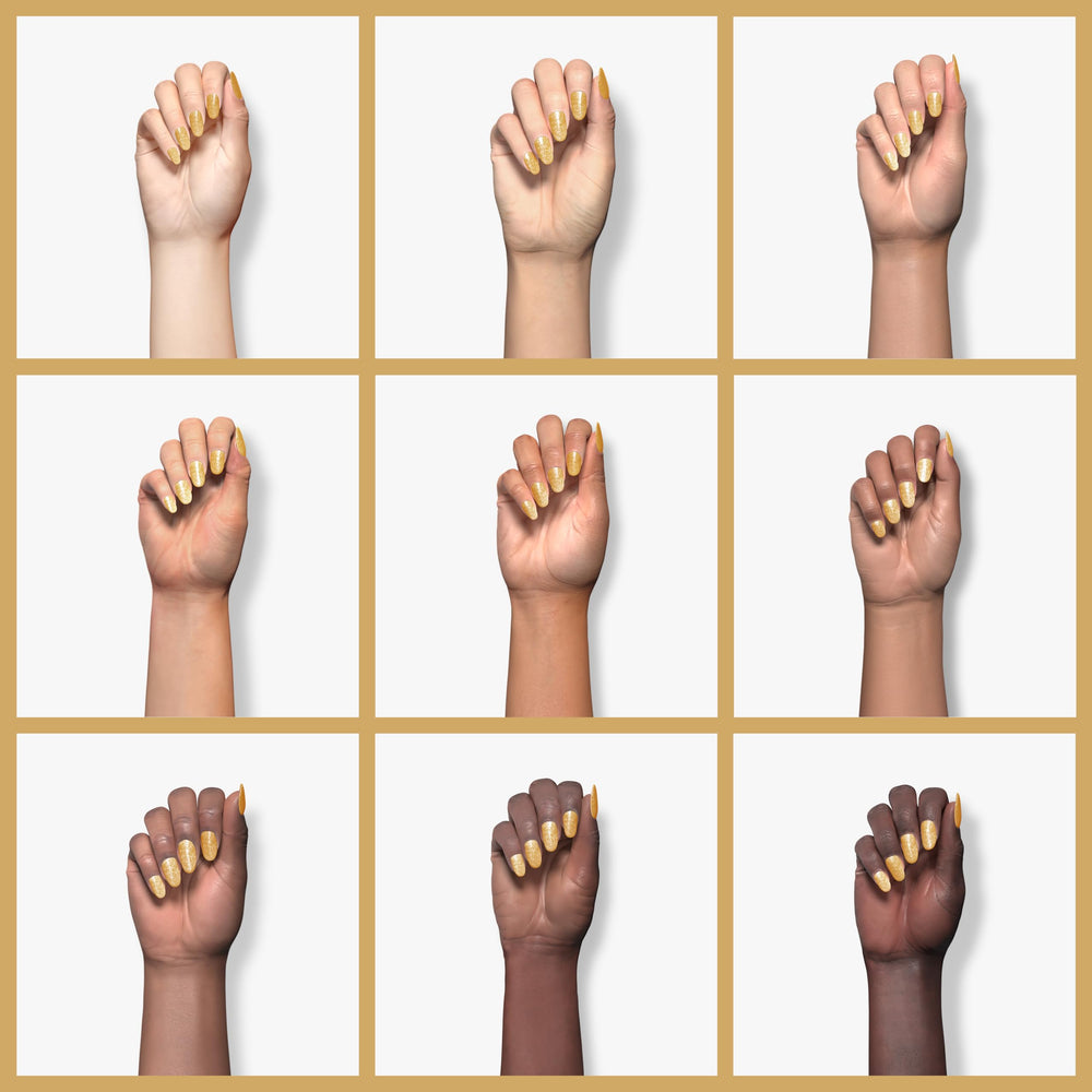 Beetles Gold Gel Polish application demonstrates smooth glide on nails.