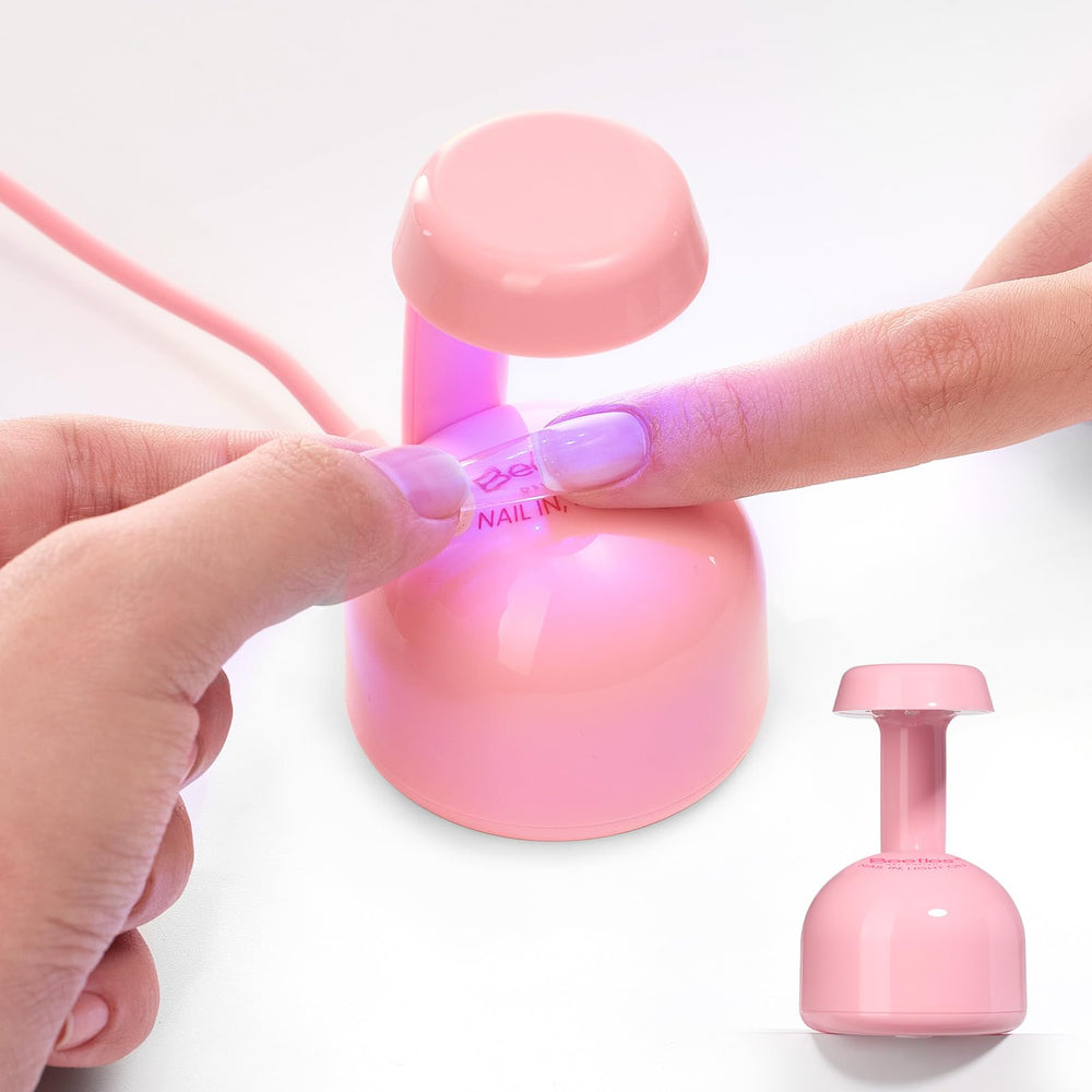 Beetles Mini UV Light front view, compact pink gel nail lamp for home use.