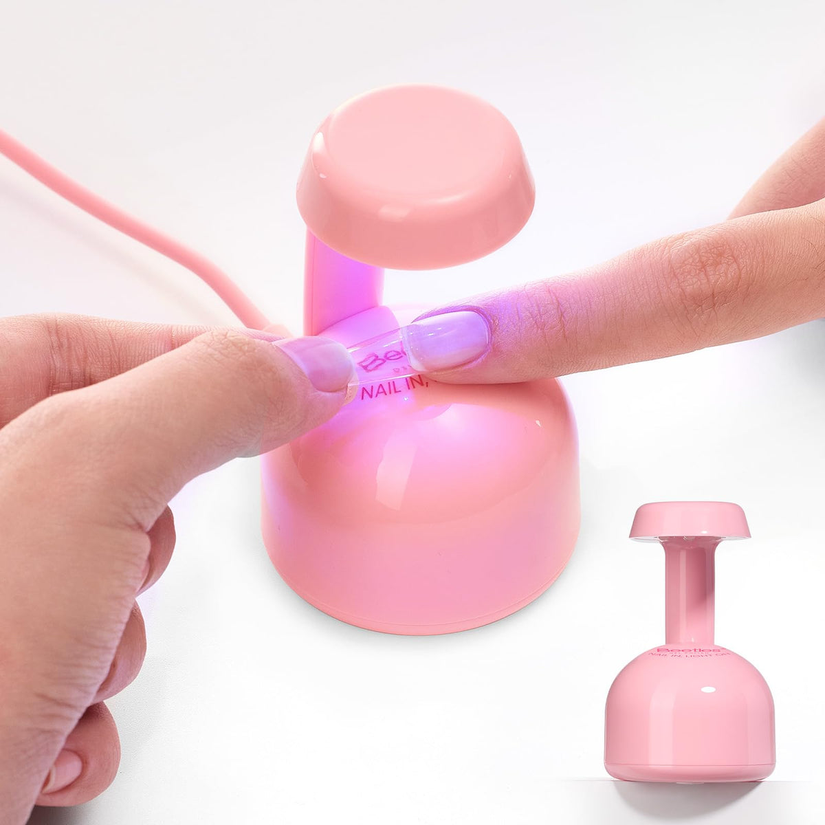 Beetles Mini UV Light front view, compact pink gel nail lamp for home use.