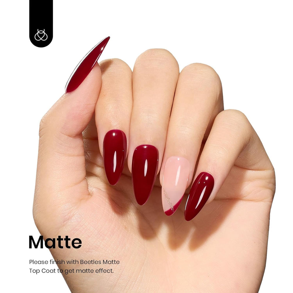Beetles Oxblood Red gel polish curing under LED lamp