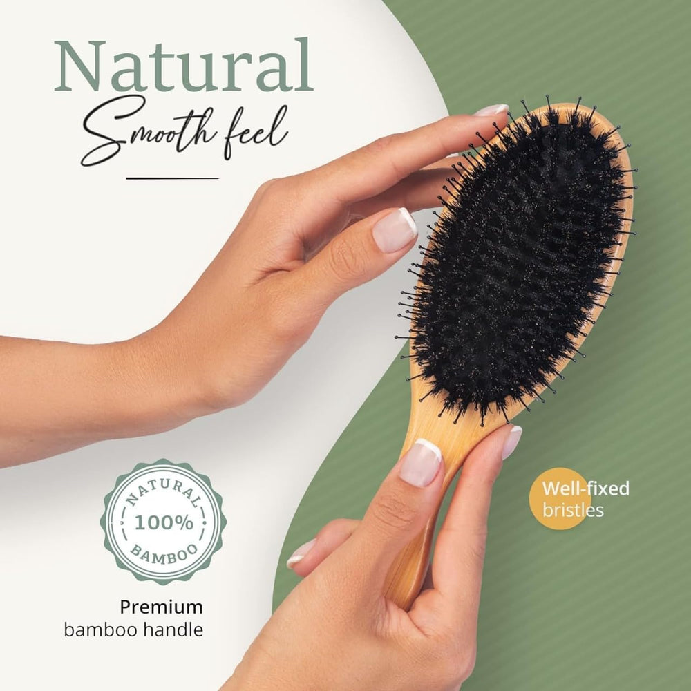 Belula Boar Bristle Hair Brush natural wood handle on sink demonstrates ergonomic design