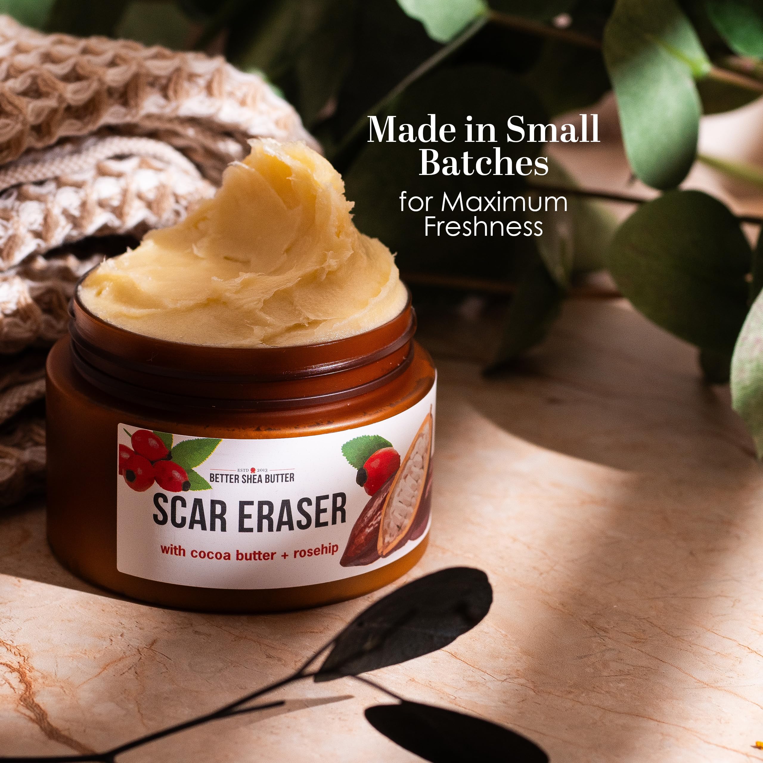 Better Shea Butter Scar Eraser Balm being spread on skin for even coverage