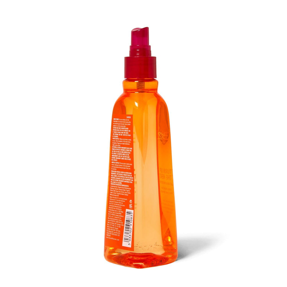 Beyond The Zone Turn Up The Heat Protection Spray misting on hair provides silky slip for easy styling.