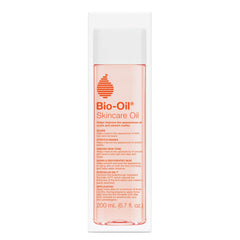Bio-Oil bottle pouring to show quick absorption and light feel on skin