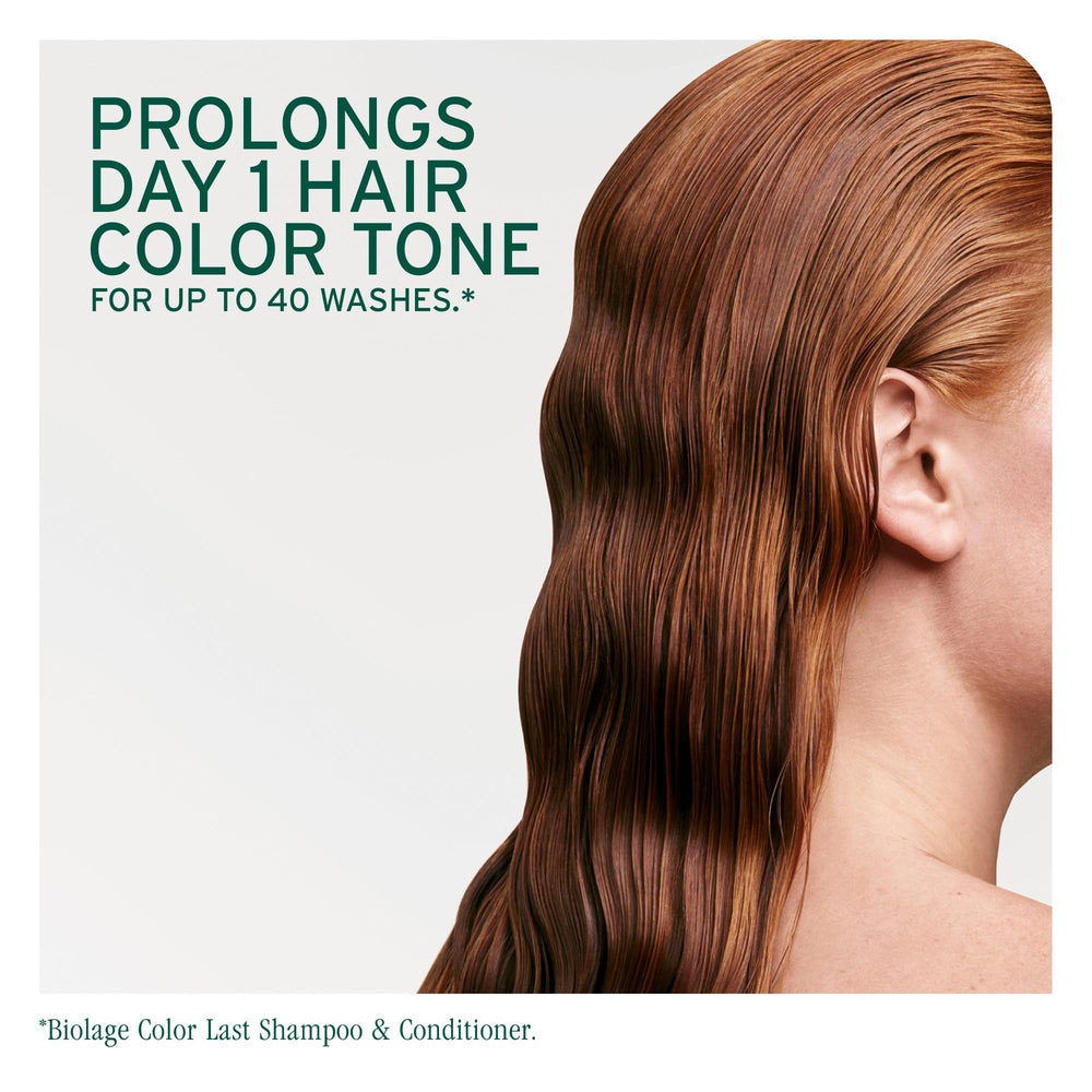 Hair being washed with Biolage Color Last indicating gentle cleanse and color preservation.