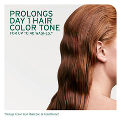 Hair being washed with Biolage Color Last indicating gentle cleanse and color preservation.