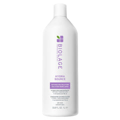 Biolage Hydra Source Detangling bottle pour showing easy dispense for instant hydration.