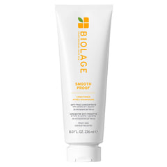 Biolage Smooth Proof Conditioner bottle pouring detangles frizzy hair.