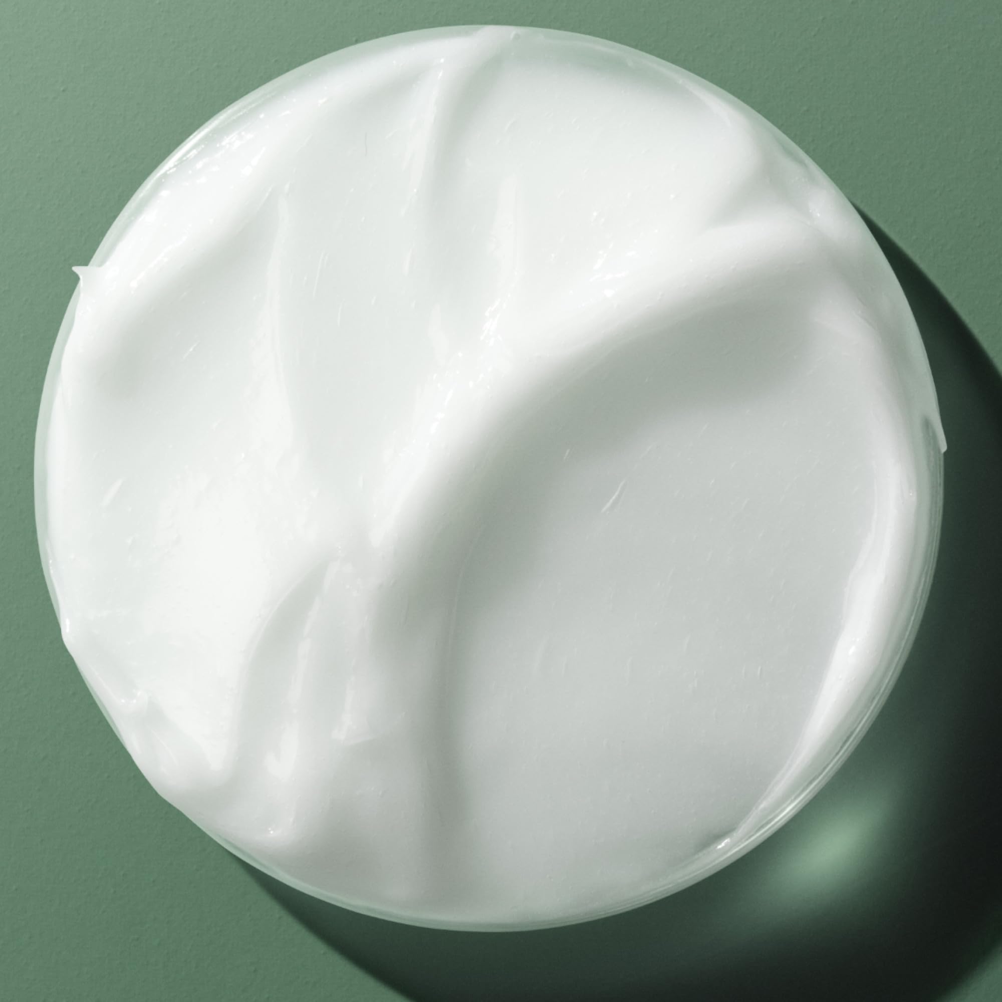 Hair after application shows a glossy, sleek finish.