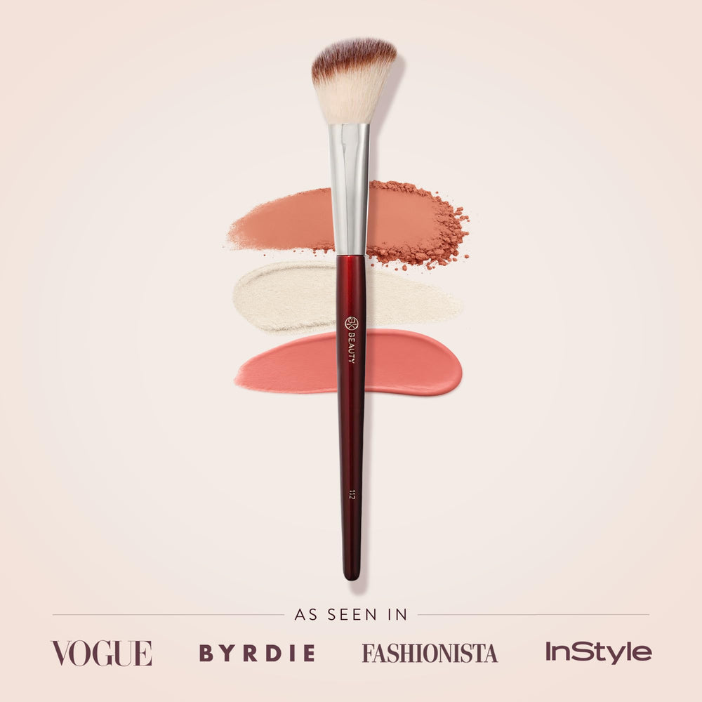 BK BEAUTY 112 small angled brush highlights cheekbones for a subtle glow.