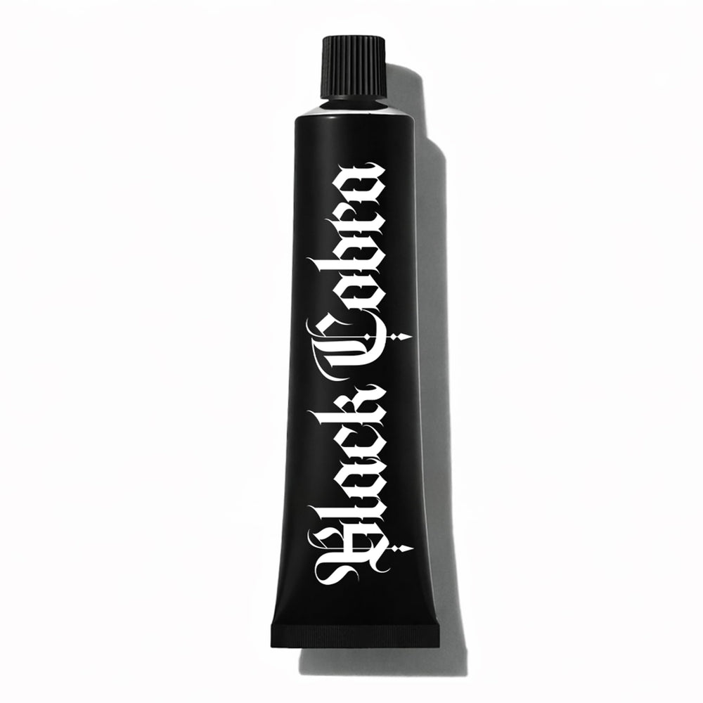 Black Cobra Tattoo Comfort Cream tube close-up, showing compact design ideal for studio prep.